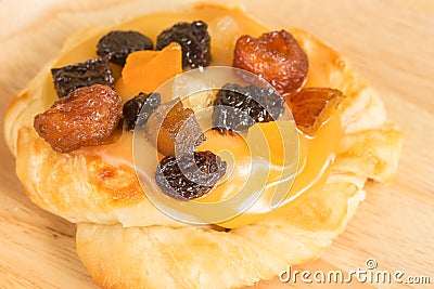Danish custard with mixed dried fruit on wooden dish Stock Photo