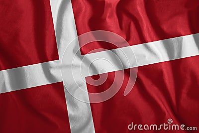 The Danish flag flutters in the wind. Colorful, national flag of Denmark. Patriotism, a patriotic symbol Stock Photo