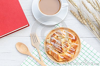 Danish pastries, coffee and note book on white wooden table Stock Photo