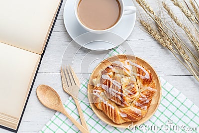 Danish pastries, coffee and note book on white wooden table Stock Photo