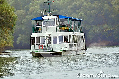 Boat in the Danube Delta seen from the Danube River. Romania Editorial Stock Photo