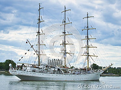 The Dar Mlodziezy, is a training ship from Gdynia, Poland. A Maritime University 3 mast Tall ship. It is navigating around the Editorial Stock Photo