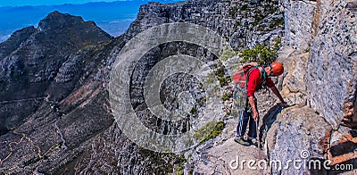 A daring European tourist rock climbing in Cape Town South Afric Editorial Stock Photo