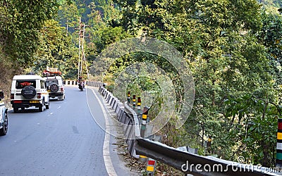 Cars on a mountain road with a very acute inner angle vehicles driving up to Darjeeling. traveling concept Editorial Stock Photo