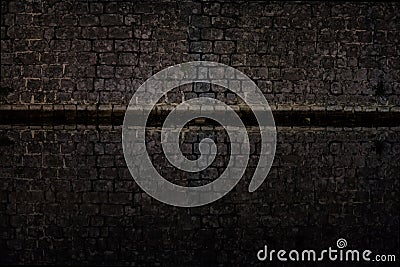 Dark Abstract Background - Medieval town walls surrounded by sea Stock Photo