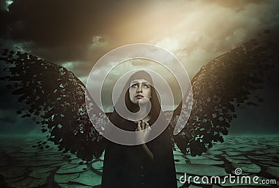 Dark angel with broken wings Stock Photo