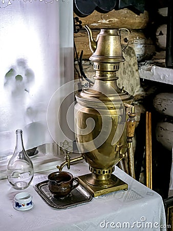 dark antique copper samovar on the table Stock Photo