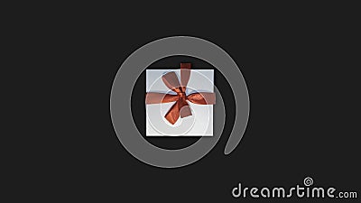 Dark background. Gift box. White gift box with red ribbon on a dark background. View from above. Stock Photo