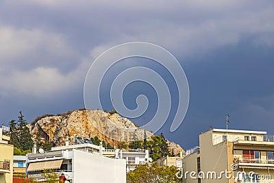 Dark black storm clouds over Greek city panorama Athens Greece Stock Photo