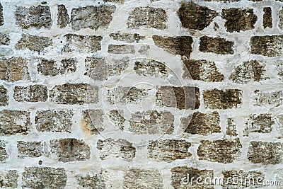 Dark brick and white grout wall in industrial urban area of downtown city with aged and weather exterior or facade Stock Photo