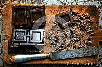 Dark chocolate chopped on a wooden board Stock Photo