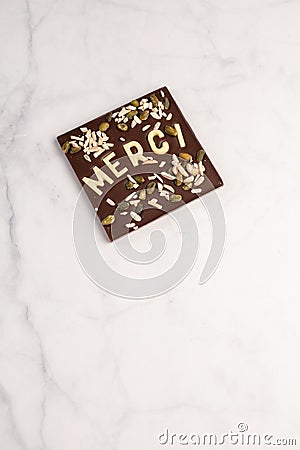 Dark chocolate square with white chocolate thank you note Stock Photo