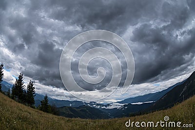 Dark clouds over a valley in the Carpathians mountains Stock Photo