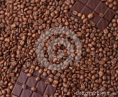 Dark coffee beans with chocolate pieces Stock Photo