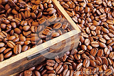 Dark coffee beans in a wooden box. Stock Photo