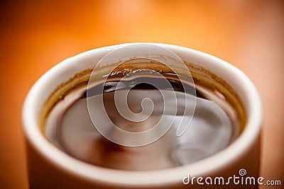 Dark coffee in a coffee cup Stock Photo