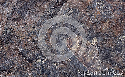 Dark colored natural hill stone texture background. Stock Photo
