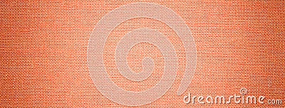 Dark coral background from textile material with wicker pattern, and vignette. Peach fuzz fabric with texture Stock Photo