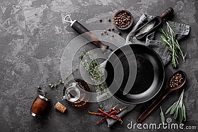 Dark culinary background with empty black pan Stock Photo