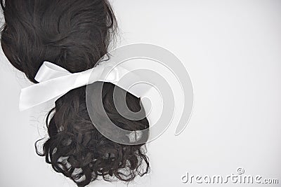 Dark curly hair with white lace on the white background Stock Photo