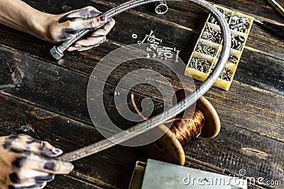 Dark dirty man hands holding professional working tools f Stock Photo