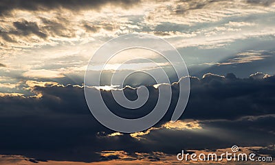 Dark Dramatic Cloudy Cloudscape with Sunrays Stock Photo