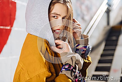 Dark-eyed young photo model with pleasant appearance working outside Stock Photo