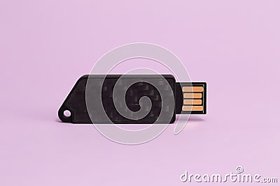 Dark flash drive on a violet background Stock Photo