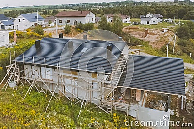 dark gray roof of an industrial building made of metal. Corrugat Stock Photo