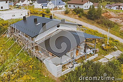 dark gray roof of an industrial building made of metal. Corrugat Stock Photo