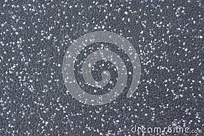 Dark Gray Stone Floor Made of Small Gravels of White, Gray and Black Colors. Stock Photo