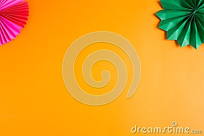 Dark green decorative paper cigar on an orange textured background Stock Photo