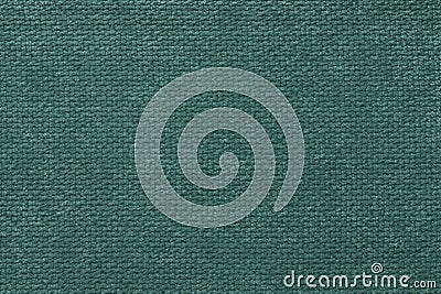 Dark green fluffy background of soft, fleecy cloth. Texture of light nappy textile, closeup. Stock Photo