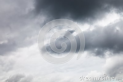 Dark grey rainy clouds in overcast sky Stock Photo