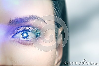 Dark haired woman with a robot eye, cyborg hi tech Stock Photo