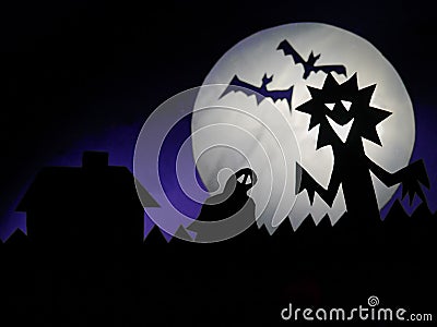 Dark Halloween season background with moon in the background and scary creatures silhouettes. Alien, bats, and funny monster Stock Photo