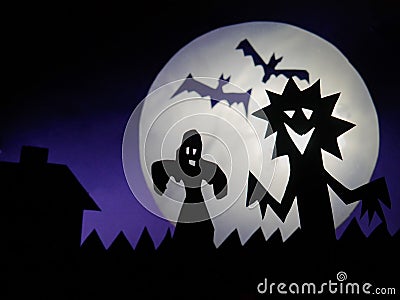 Dark Halloween season background with moon in the background and scary creatures silhouettes.Dark Halloween season background with Stock Photo