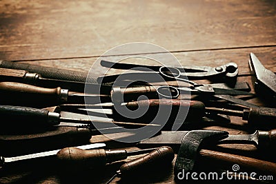 Dark jumble of old vintage hand tools Stock Photo