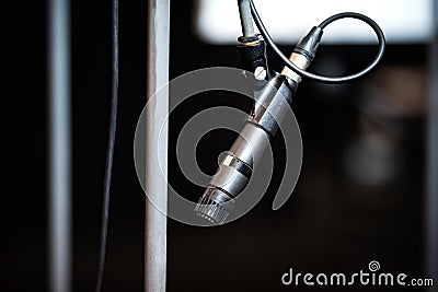 Dark microphone on stand Stock Photo