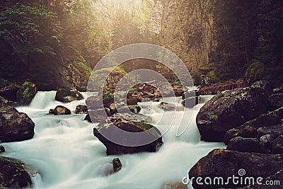 Dark mountain stream Stock Photo