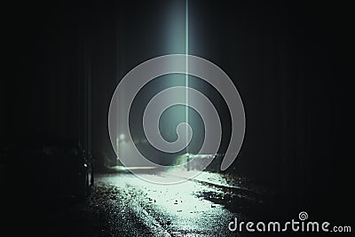 A dark mysterious edit of an empty country road with a parked car and with street lights on a misty winters nights Stock Photo