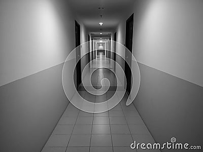 Dark narrow corridor between room in the apartment service. Stock Photo