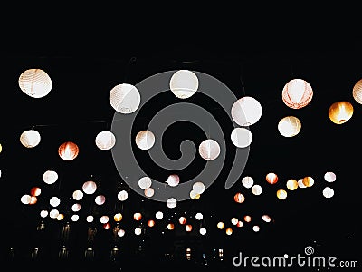 A dark night filled with lanterns Stock Photo