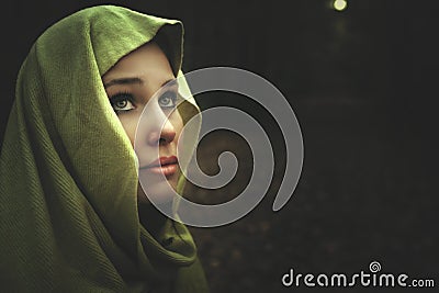 Dark night portrait of mysterious beautiful woman Stock Photo