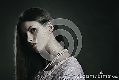 Dark portrait of pale woman Stock Photo