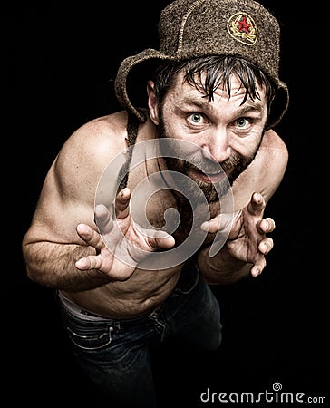 Dark portrait of scary evil sinister bearded man with smirk, makes various hand's signs and expresses different emotions Stock Photo