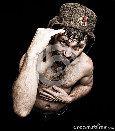 Dark portrait of scary evil sinister bearded man with smirk, makes various hand's signs and expresses different emotions Stock Photo