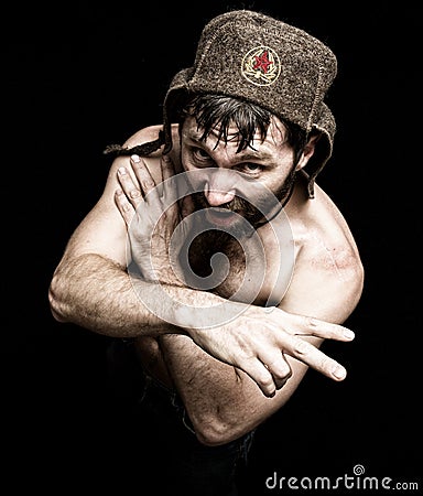 Dark portrait of scary evil sinister bearded man with smirk, makes various hand's signs and expresses different emotions Stock Photo