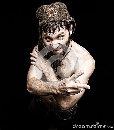 Dark portrait of scary evil sinister bearded man with smirk, makes various hand's signs and expresses different emotions Stock Photo