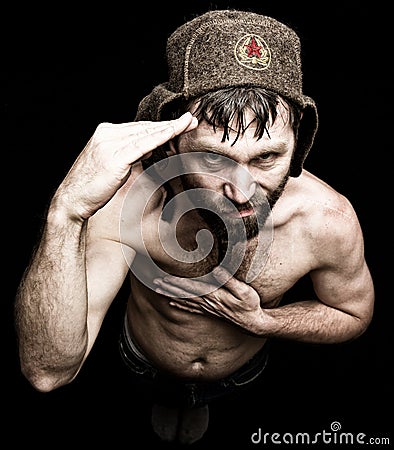 Dark portrait of scary evil sinister bearded man with smirk, makes various hand's signs and expresses different emotions Stock Photo